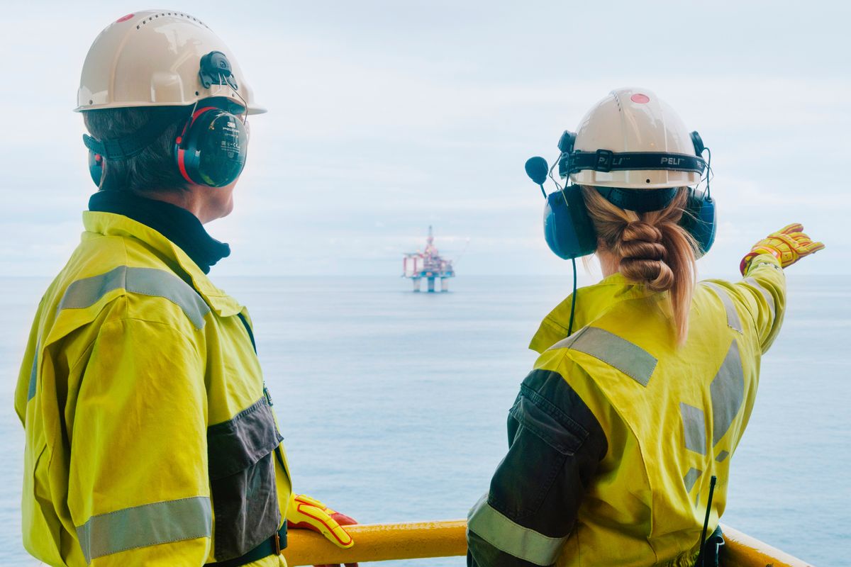 Offshore workers looking out to sea