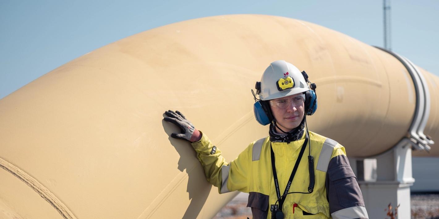 Equinor employee next to the Europipe II natural gas pipeline at Kårstø