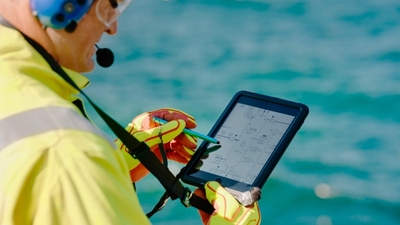 Equinor employee with digital tool in his hands
